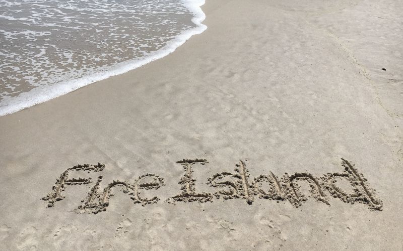 Fire Island written in sand